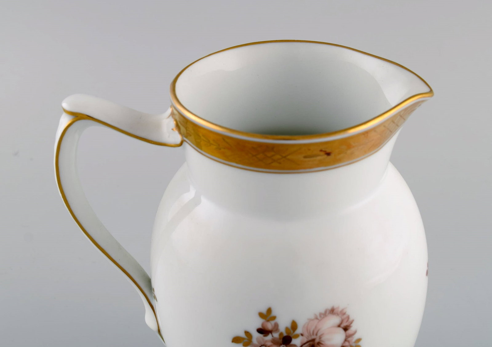 Royal Copenhagen Golden basket jug in porcelain with flowers and gold decoration. Model number - 4