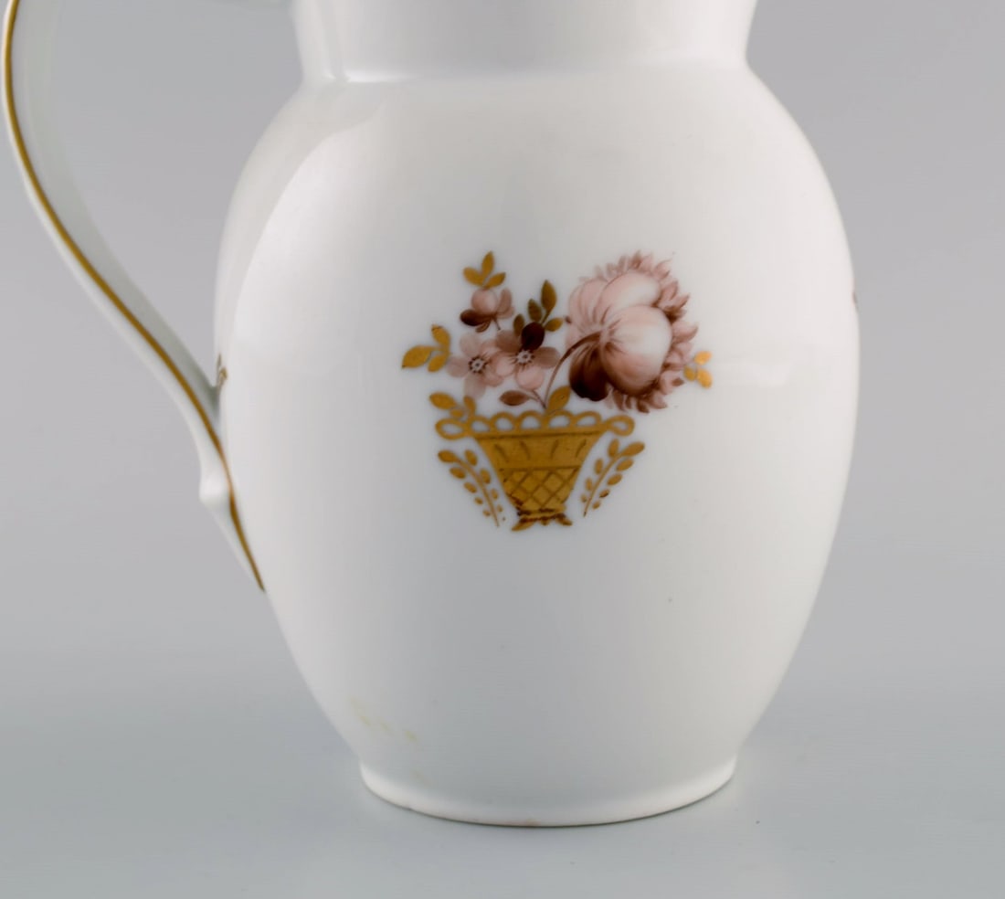 Royal Copenhagen Golden basket jug in porcelain with flowers and gold decoration. Model number - 5