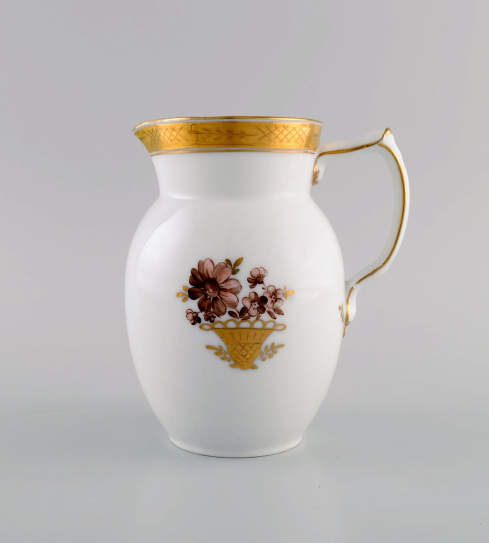 Royal Copenhagen Golden basket jug in porcelain with flowers and gold decoration. Model number - 2