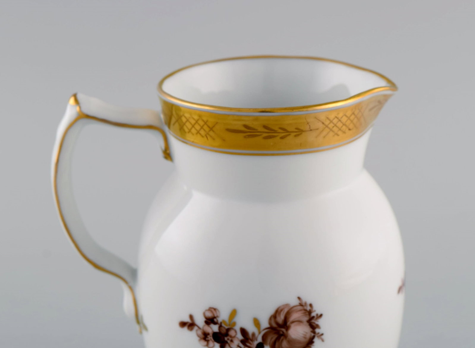 Royal Copenhagen Golden basket jug in porcelain with flowers and gold decoration. Model number - 4