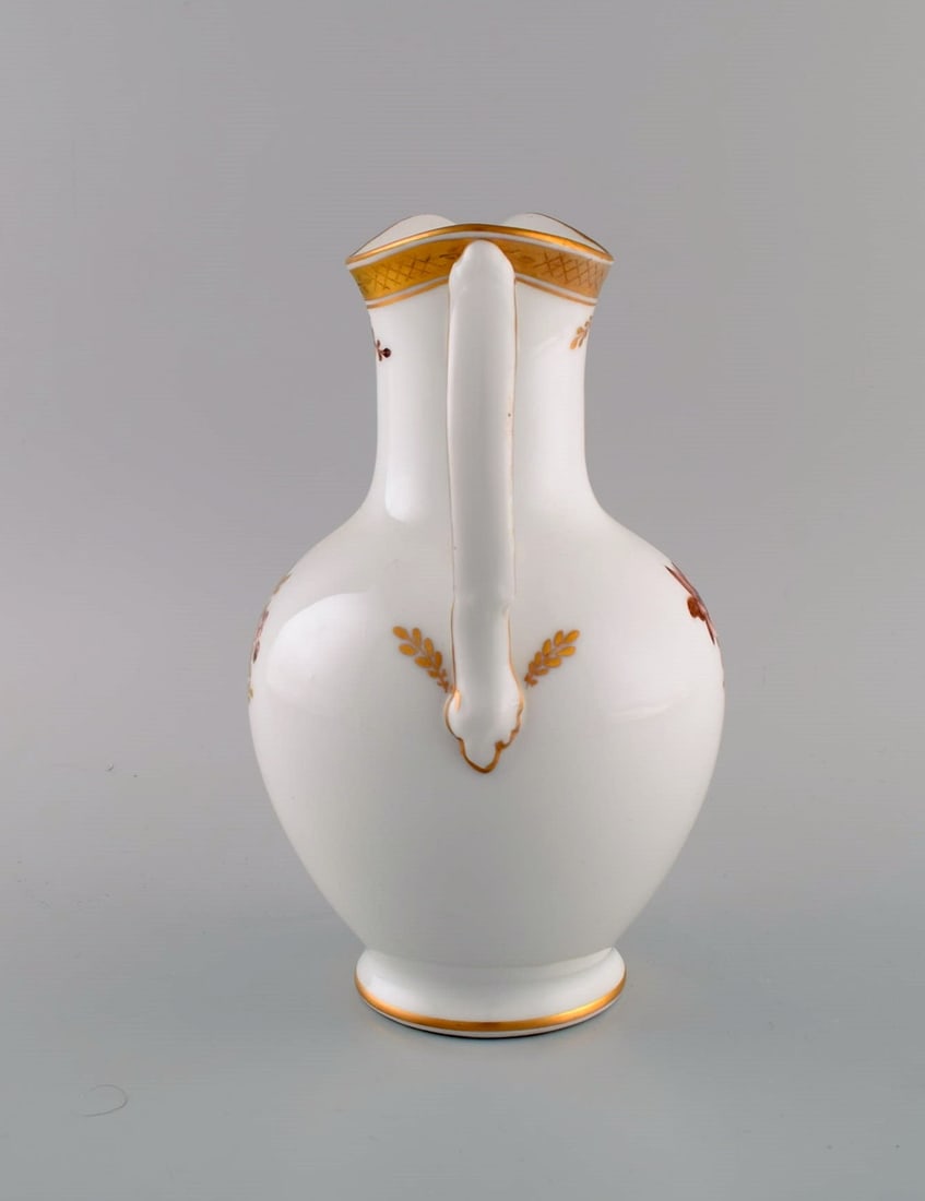 Royal Copenhagen Golden Basket chocolate jug in porcelain with flowers and gold decoration. Model - 6