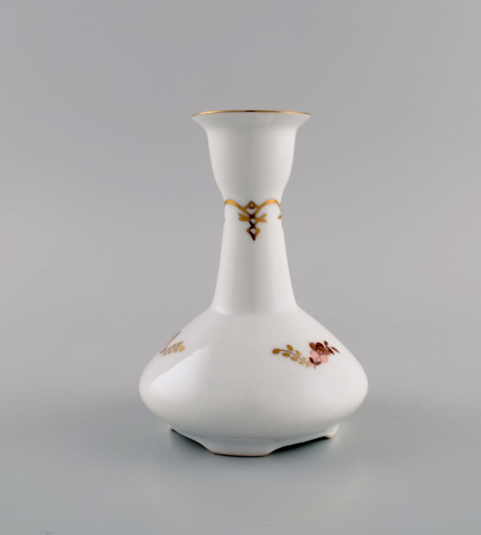 Two Royal Copenhagen Golden Basket candlesticks in porcelain with flowers and gold decoration. Model - 6