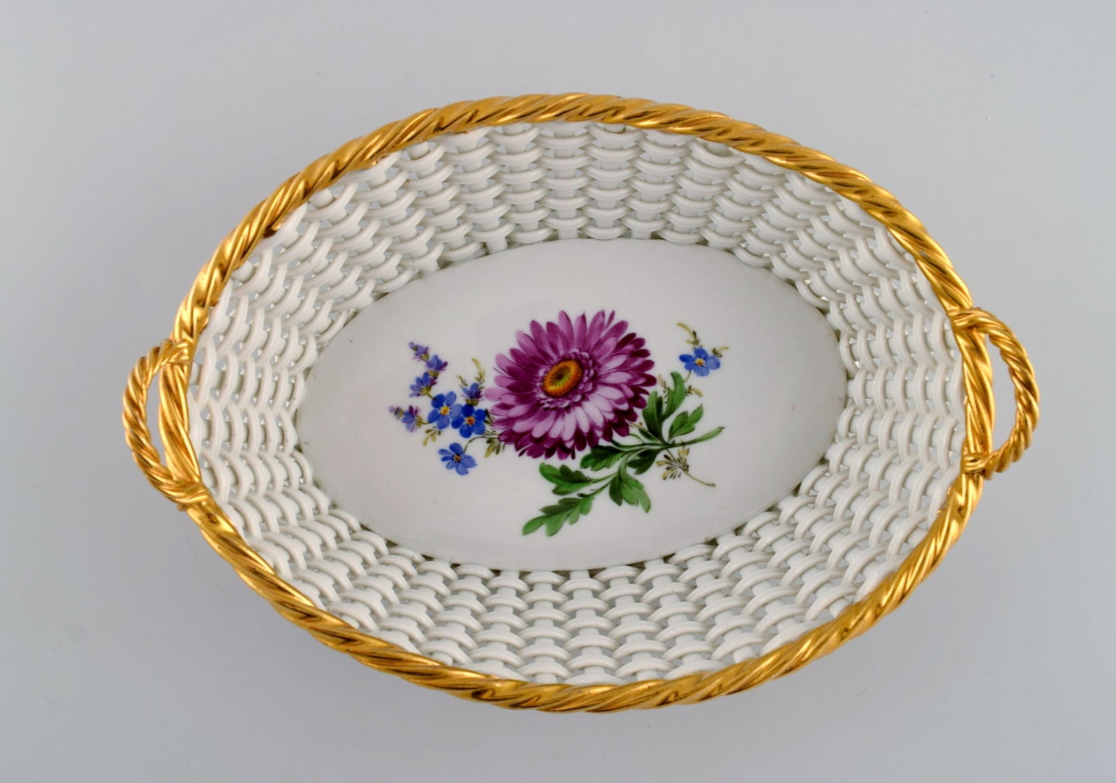Antique Meissen braided porcelain basket with handles. Hand-painted flowers and golden border. Late: Title: Antique Meissen braided porcelain basket with handles. Hand-painted flowers and golden border. Late 19th century. Description: Antique Meissen braided porcelain basket with handles.