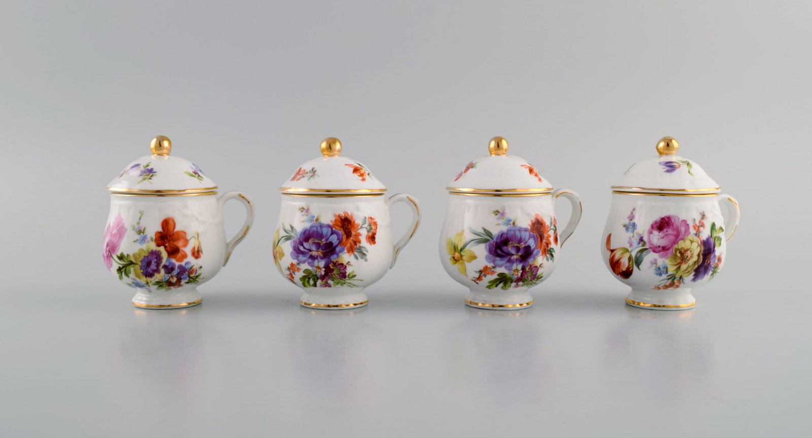 10 antique Rorstrand porcelain cream cups with hand-painted flowers and gold decoration. Approx. - 3