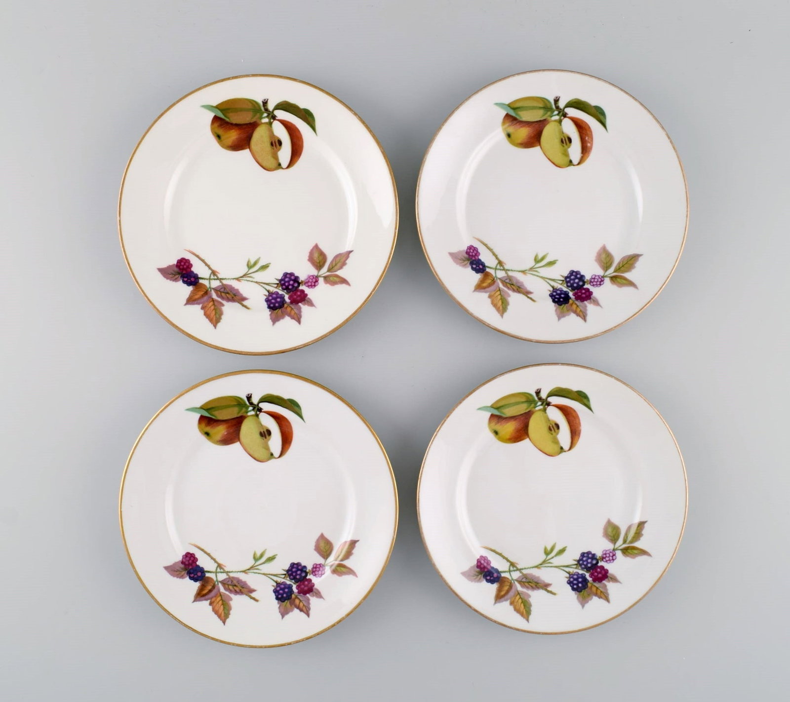 Royal Doulton, England. Four Evesham plates in porcelain decorated with fruits and gold edge. 1960s. (1 of 6)