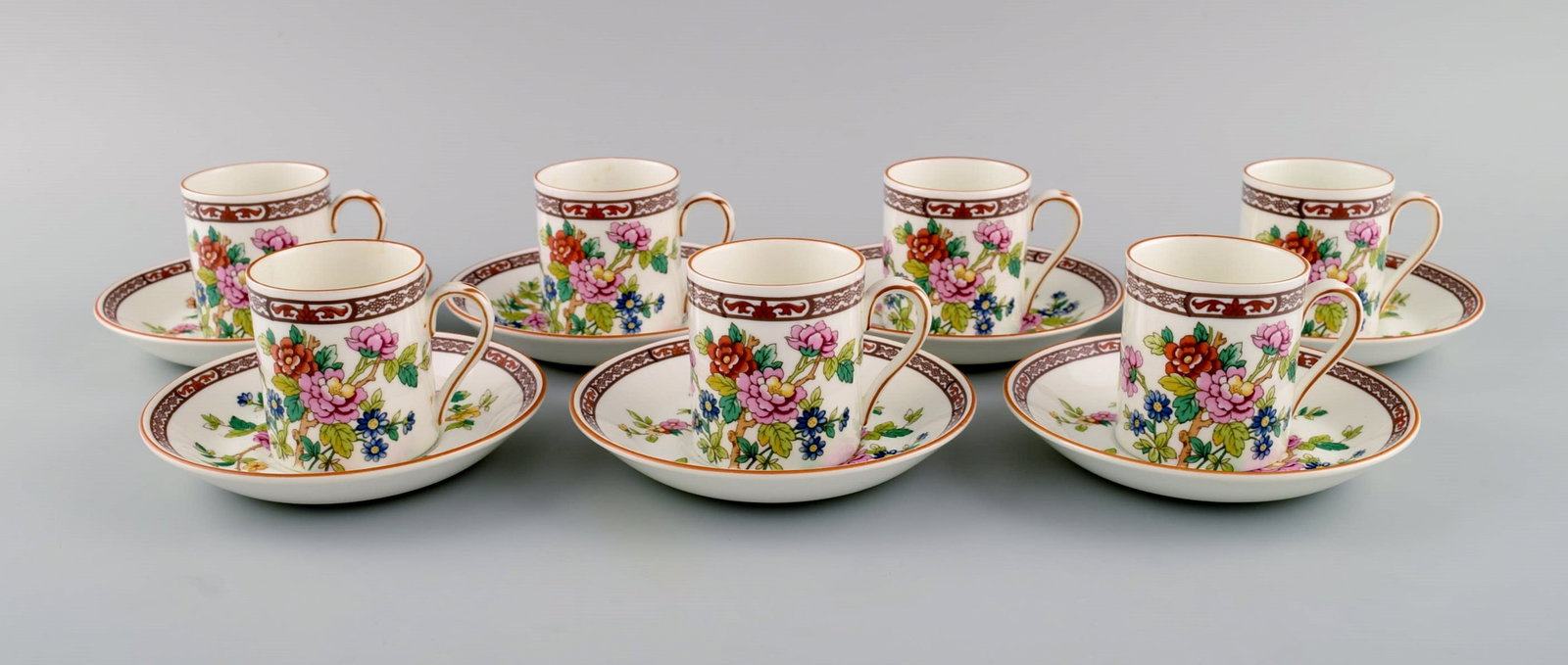 Coalport, England. Seven Flower of Tibet chocolate cups with saucers decorated with flowers and gold - 2