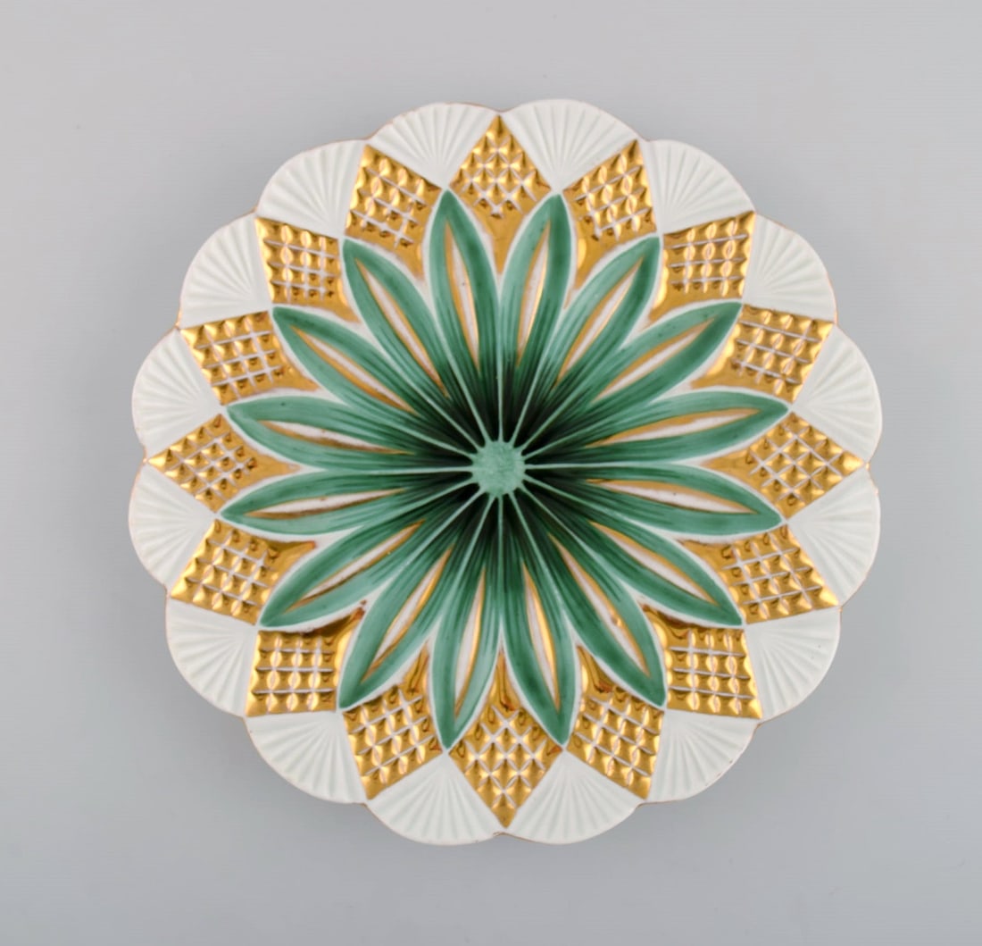 Two antique Meissen plates in hand-painted porcelain. Light green flowers and gold decoration. Early - 2