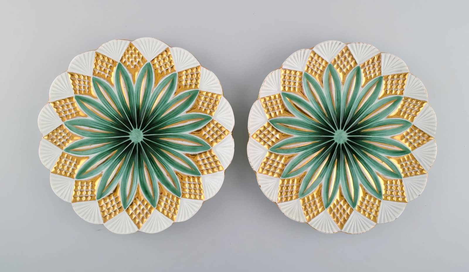 Two antique Meissen plates in hand-painted porcelain. Light green flowers and gold decoration. Early - 6