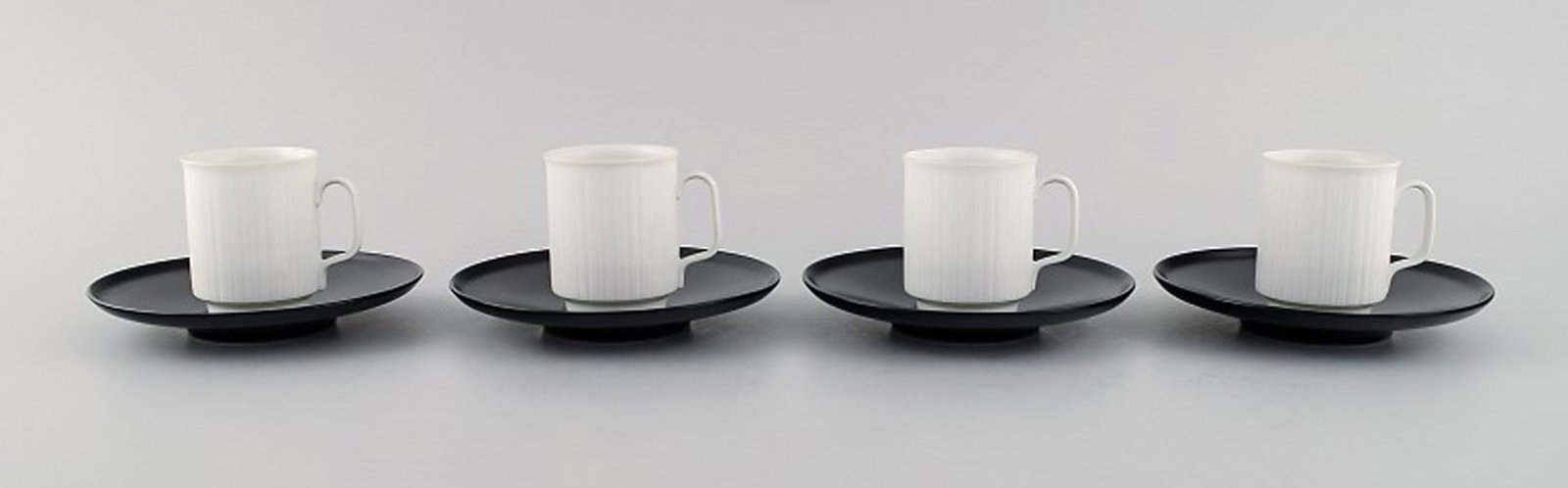 Tapio Wirkkala for Rosenthal. Four porcelain noire mocha cups with saucers in black and white fluted (1 of 6)