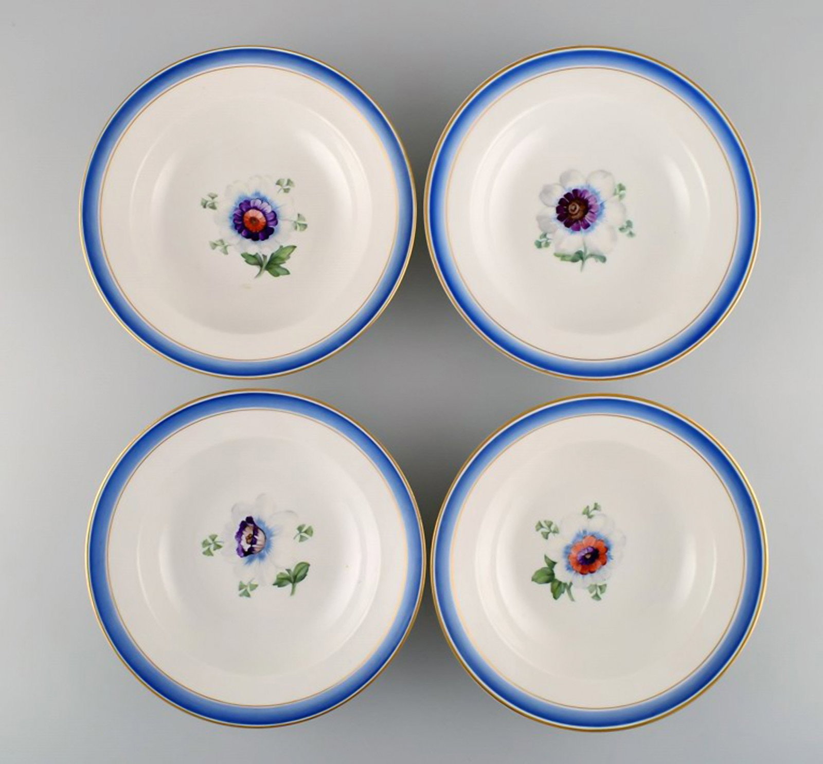 Four antique Royal Copenhagen deep plates in hand-painted porcelain with flowers and blue edge with - 2