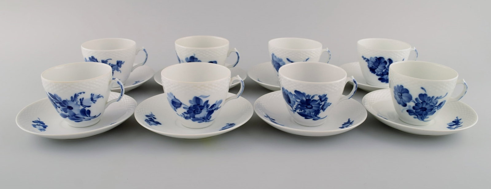 Eight Royal Copenhagen Blue Flower Braided coffee cups with saucers. Mid 20th century. Model number - 2