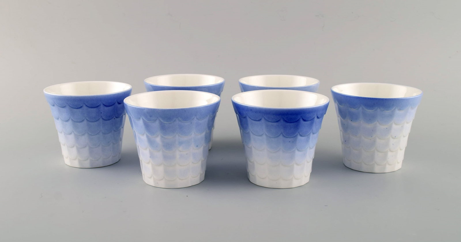 Wilhelm Kage for Gustavsberg. Six flower pot covers in porcelain. Swedish design, 1960s. - 2