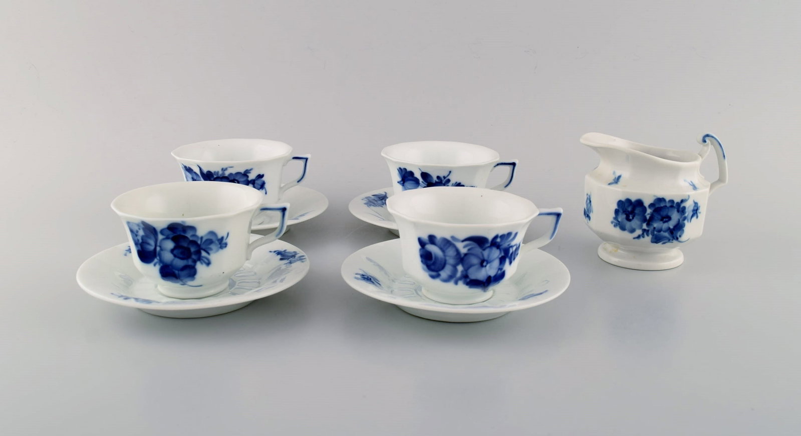 Four Royal Copenhagen Blue Flower Angular coffee cups with saucers and creamer. 1960s. - 2