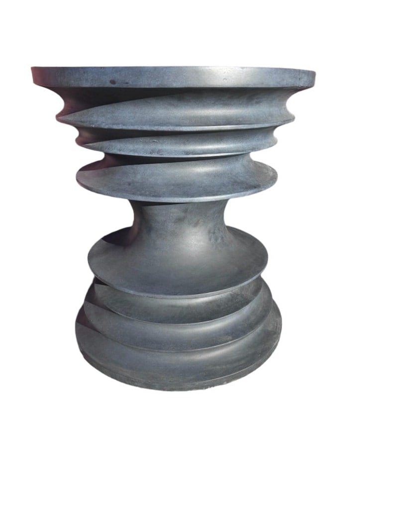 Sculptural Isalo Side Table: .Sculptural Isalo Side TableFeaturing a Isalo side table by Stone Yard, Inc. Uniquely shaped side/end table adds a playful accent to your home. Elevate your space with its sculptural flair. Its