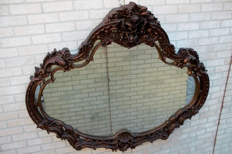 Vintage Italian Ornate Wall Mirror: Vintage Italian Ornate Wall Mirror This Vintage Italian Ornate Wall Mirror featuring intricate detailing that reflects the elegance of classic Italian design. Its ornate frame, adorned with delicate