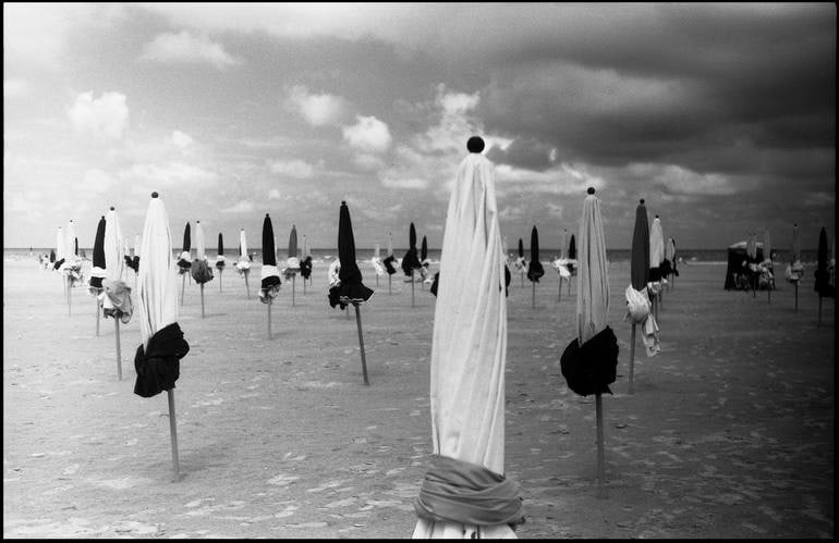 Parasols, Deauville Beach, France - Silver Gelatin Photograph: Title: Parasols, Deauville Beach, France - Silver Gelatin Photograph Dimension: 20 x 16 in Description:Parasols, Deauville Beach, France - Silver Gelatin Photograph - Limited Edition of 10 Paul Cookli