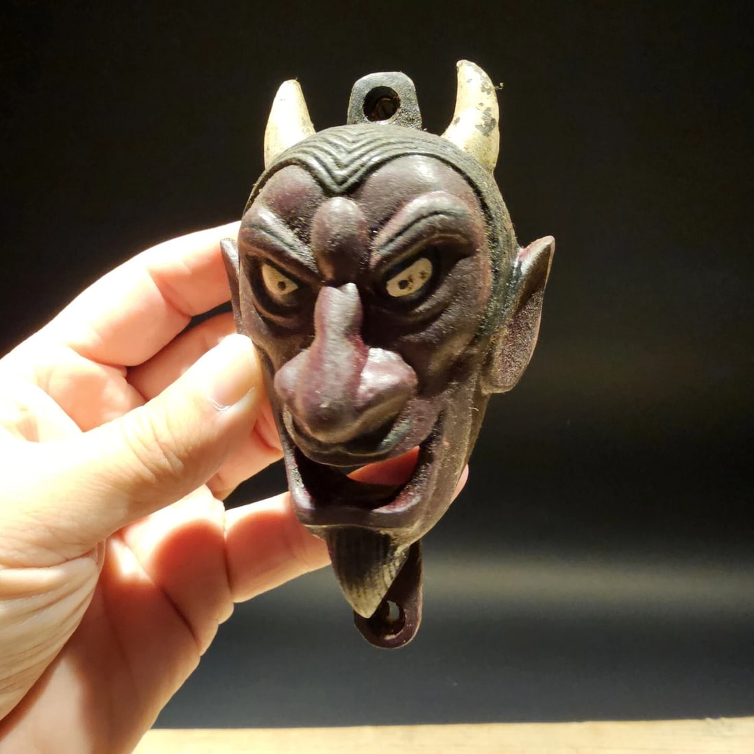 Cast Iron folk art Devil Wall mount Bottle Opener: 5 3/4" Tall x 4" Wide Great reproduction cast iron bottle opener. This piece was made to look just like an antique, but is new. Reserve: $20.00 Shipping: Domestic: Flat-rate of $8.75 to anywhere withi