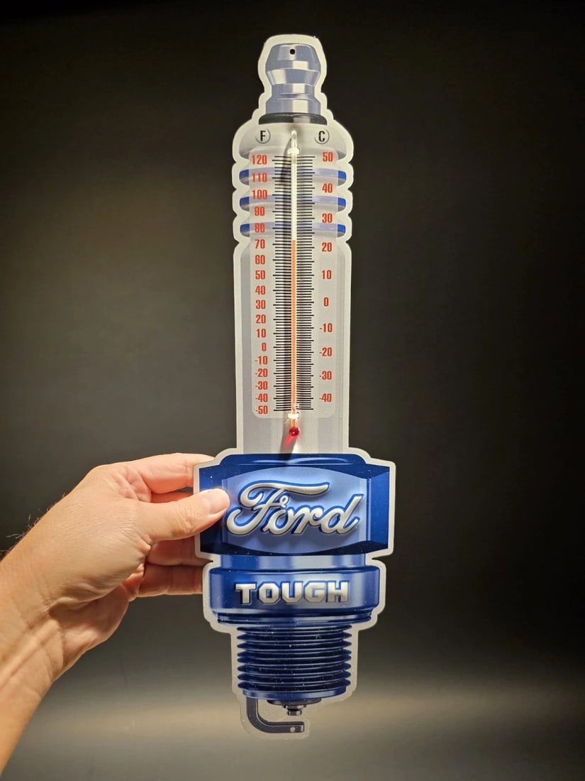 17 1/2 " Metal Vintage Style Ford Thermometer Sign: 17.5 x 5 in This classic reproduction Ford thermometer is a must-have for any garage or man cave. Crafted from durable 24 gauge steel and printed with UV-resistant inks, this thermometer is built to