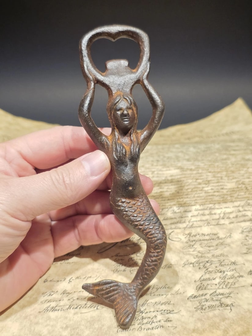 7" Cast Iron Mermaid Bottle Opener Coastal Bar Tool: Cast iron mermaid bottle opener in the style of early nautical bar tools and seaside souvenir pieces popular from the late 19th through mid-20th century. Figural openers like this were commonly found 
