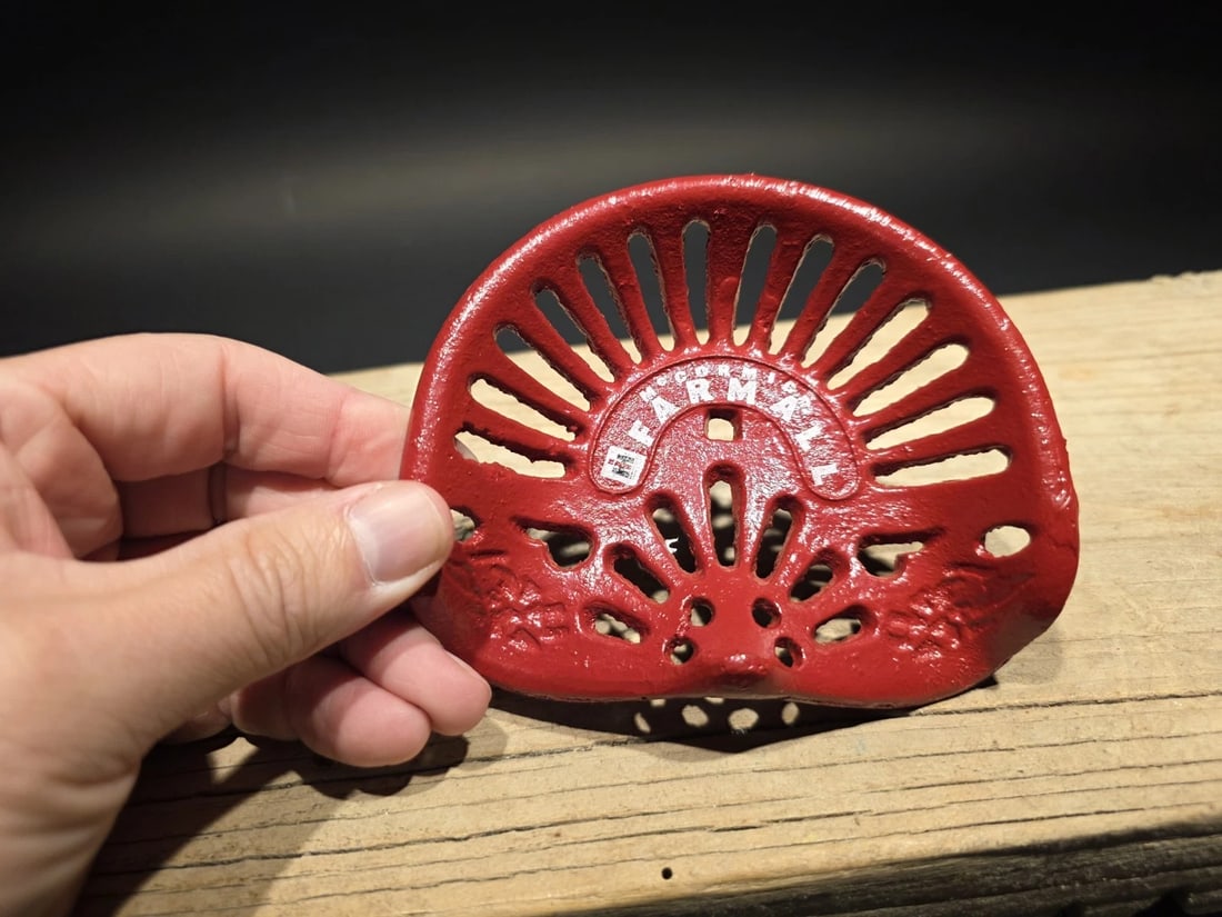 5" Cast Farmall Miniature Tractor Seat Sample: Nice Reproduction solid cast iron Farmall tractor seat. Certainly a great item! Be sure to see the images, for construction and manufacture details Reserve: $25.00 Shipping: Domestic: Flat-rate of