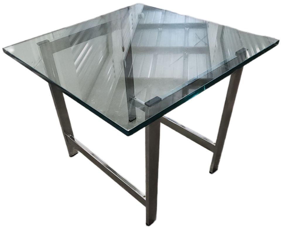 Vintage Modern Chromed Steel and glass side table after Milo Baughman: Vintage Modern Chromed Steel and glass side table after Milo Baughman Reserve: $100.00 Shipping: Domestic: Shipping rates are determined by destination International: Foreign shipping rates are determ