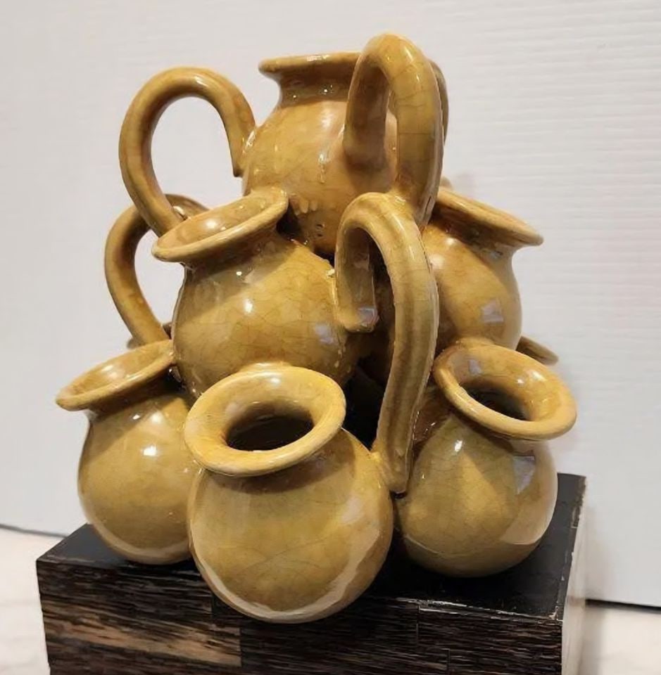 Unique Vintage Ceramic Sculpture of Small Vessels Joined Together: This wonderful ceramic sculpture is a unique piece featuring a yellowish-brown crackled glaze. It comprises multiple small vessels, each equipped with a handle, joined together to form the overall