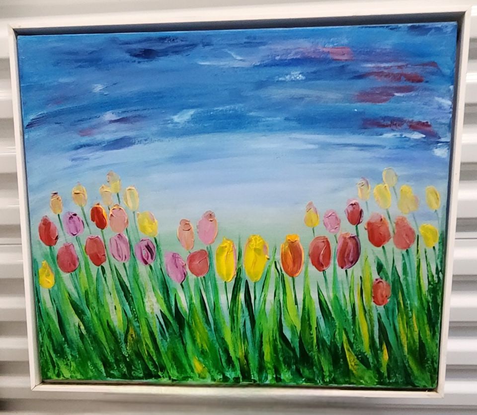 Vibrant impressionist impasto oil painting of tulip field w/ brilliant colors & rich texture. Signed: This wonderfully executed painting has a field of tulips with green stems and leaves. Tulips are in shades of red, pink, yellow, and orange. Painting has a blue sky with some darker blue and reddish