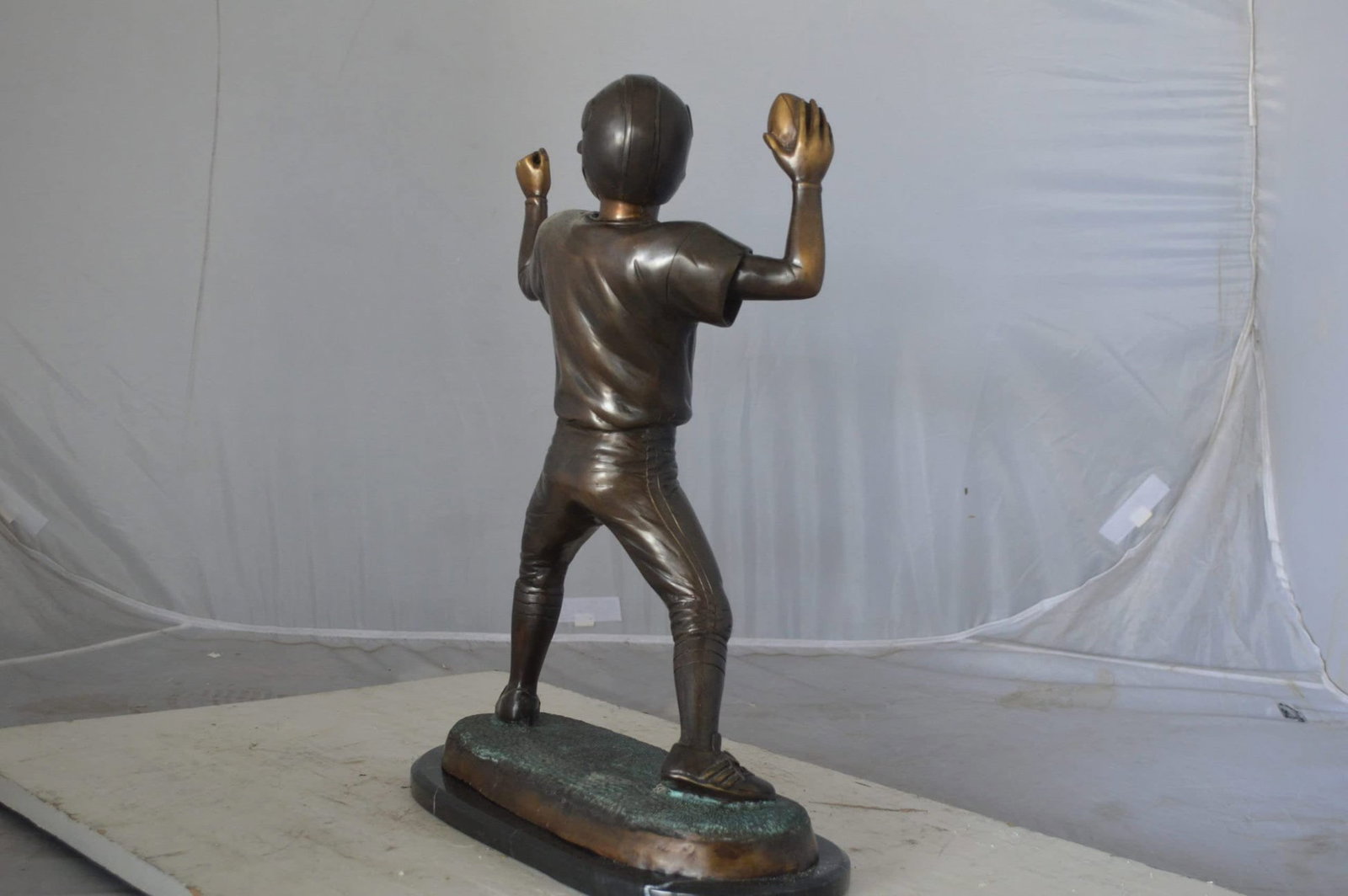 Young Quarterback bronze statue - Size: 14"L x 6"W x 20"H. - 10