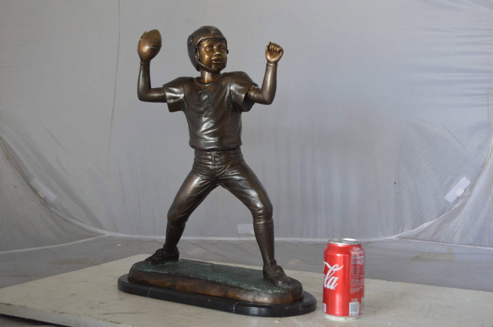 Young Quarterback bronze statue - Size: 14"L x 6"W x 20"H. - 5