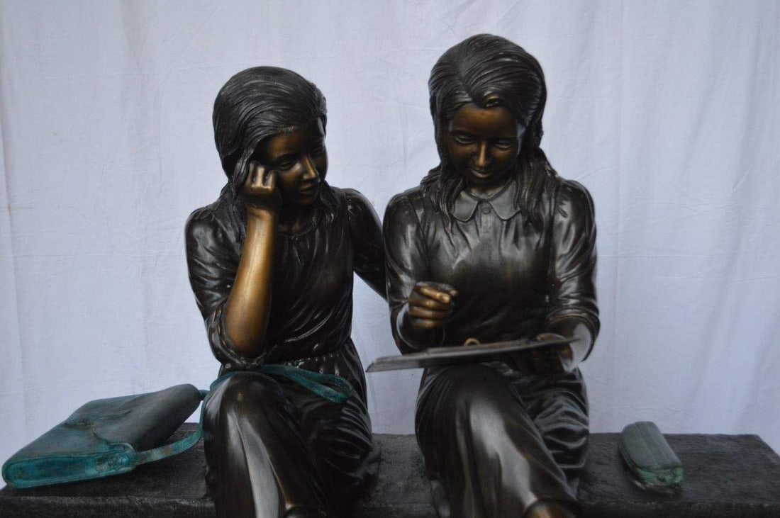 Two Schoolgirls Sitting On a Bench Bronze Statue - Size: 45"L x 24"W x 41"H. - 3