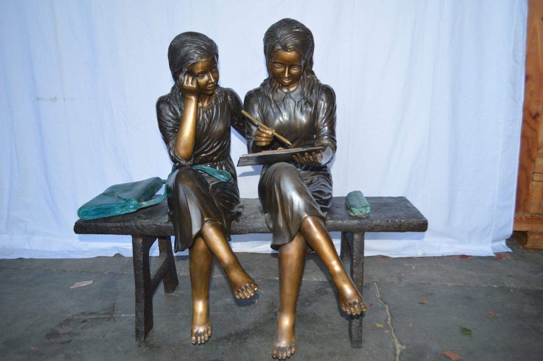 Two Schoolgirls Sitting On a Bench Bronze Statue - Size: 45"L x 24"W x 41"H. - 5
