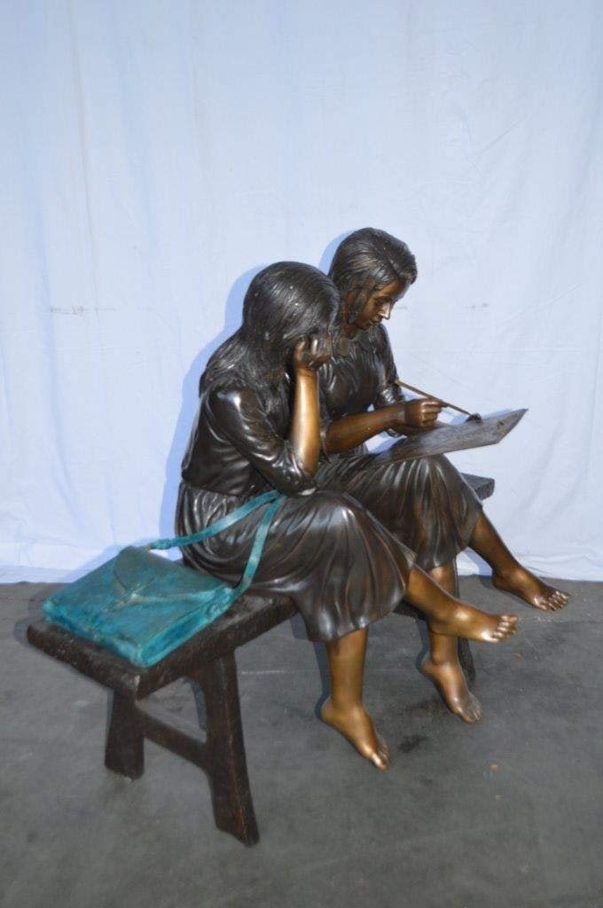 Two Schoolgirls Sitting On a Bench Bronze Statue - Size: 45"L x 24"W x 41"H. - 8