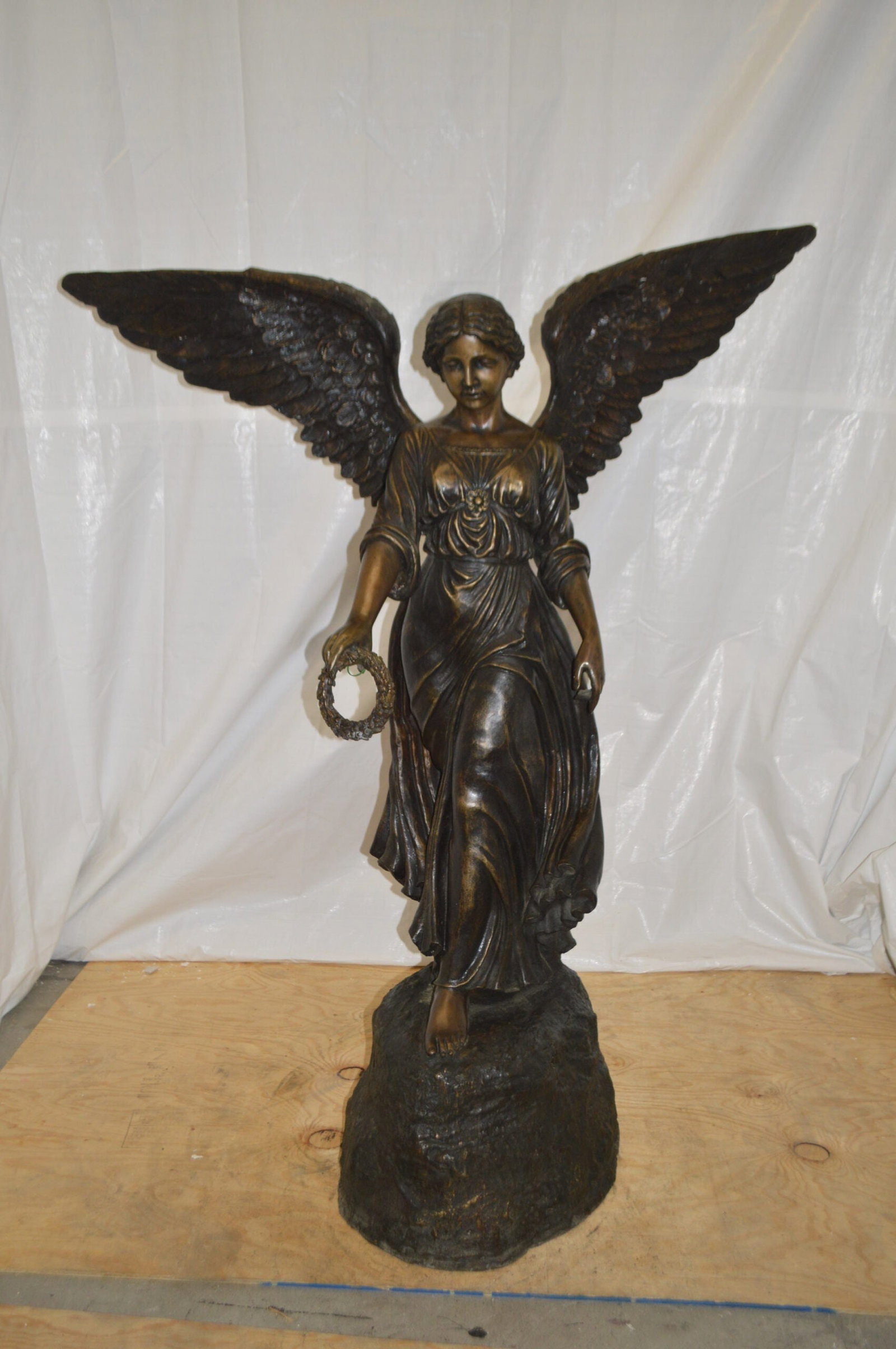 Angel Standing on a Rock Bronze Statue - Size: 60"L x 36"W x 71"H. - 2