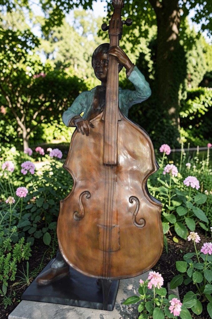 Boy playing cello large bronze statue - Size: 19"L x 22"W x 59"H. - 4
