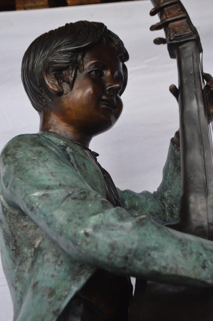 Boy playing cello large bronze statue - Size: 19"L x 22"W x 59"H. - 5