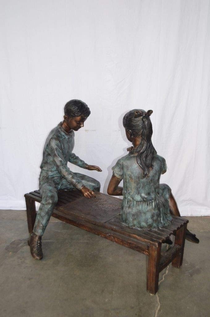 Young Couple Reviewing a World Map Bronze Statue - Size: 32"L x 47"W x 42"H. - 10