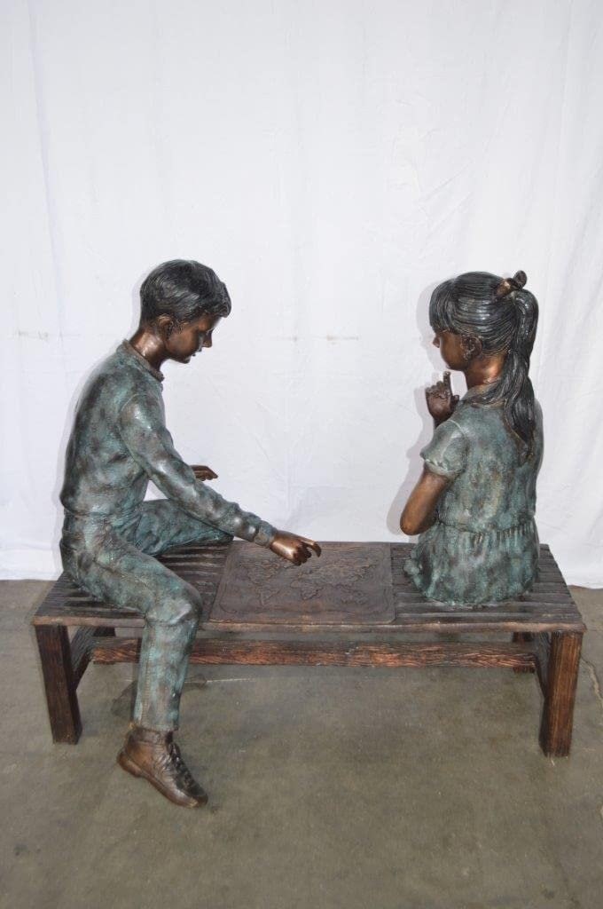 Young Couple Reviewing a World Map Bronze Statue - Size: 32"L x 47"W x 42"H. - 11