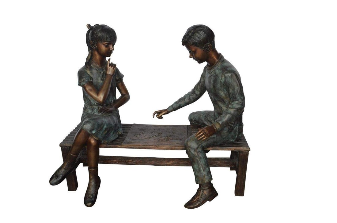 Young Couple Reviewing a World Map Bronze Statue - Size: 32"L x 47"W x 42"H.: Title:Young Couple Reviewing a World Map Bronze Statue - Size: 32"L x 47"W x 42"H. Description:This bronze statue represents a beautiful scene of a young couple reviewing the world map on a bench. The
