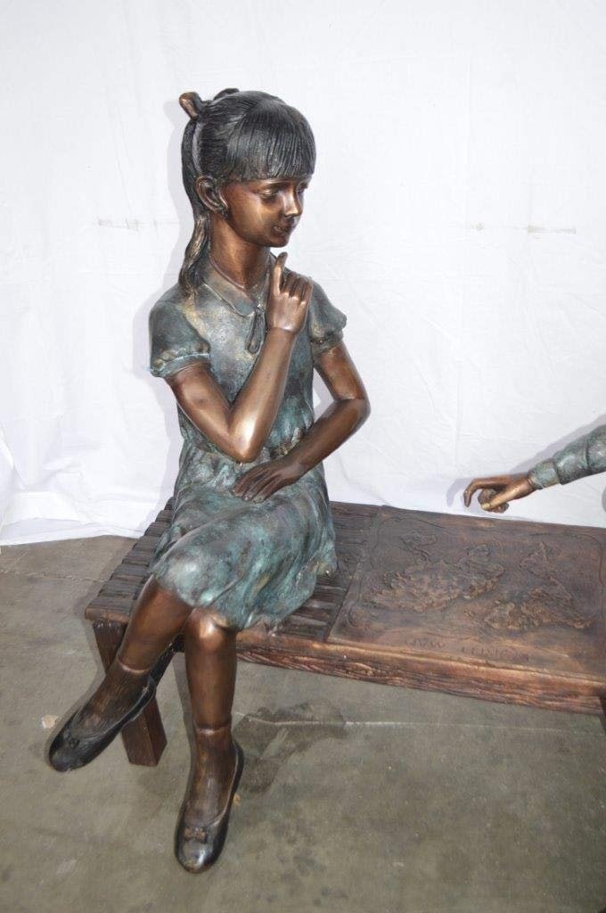 Young Couple Reviewing a World Map Bronze Statue - Size: 32"L x 47"W x 42"H. - 5