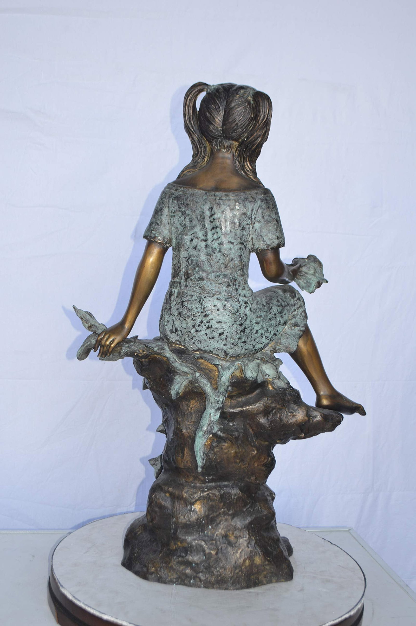Girl on Tree Trunk Holding Flowers Bronze Statue - Size: 26"L x 11"W x 36"H. - 7