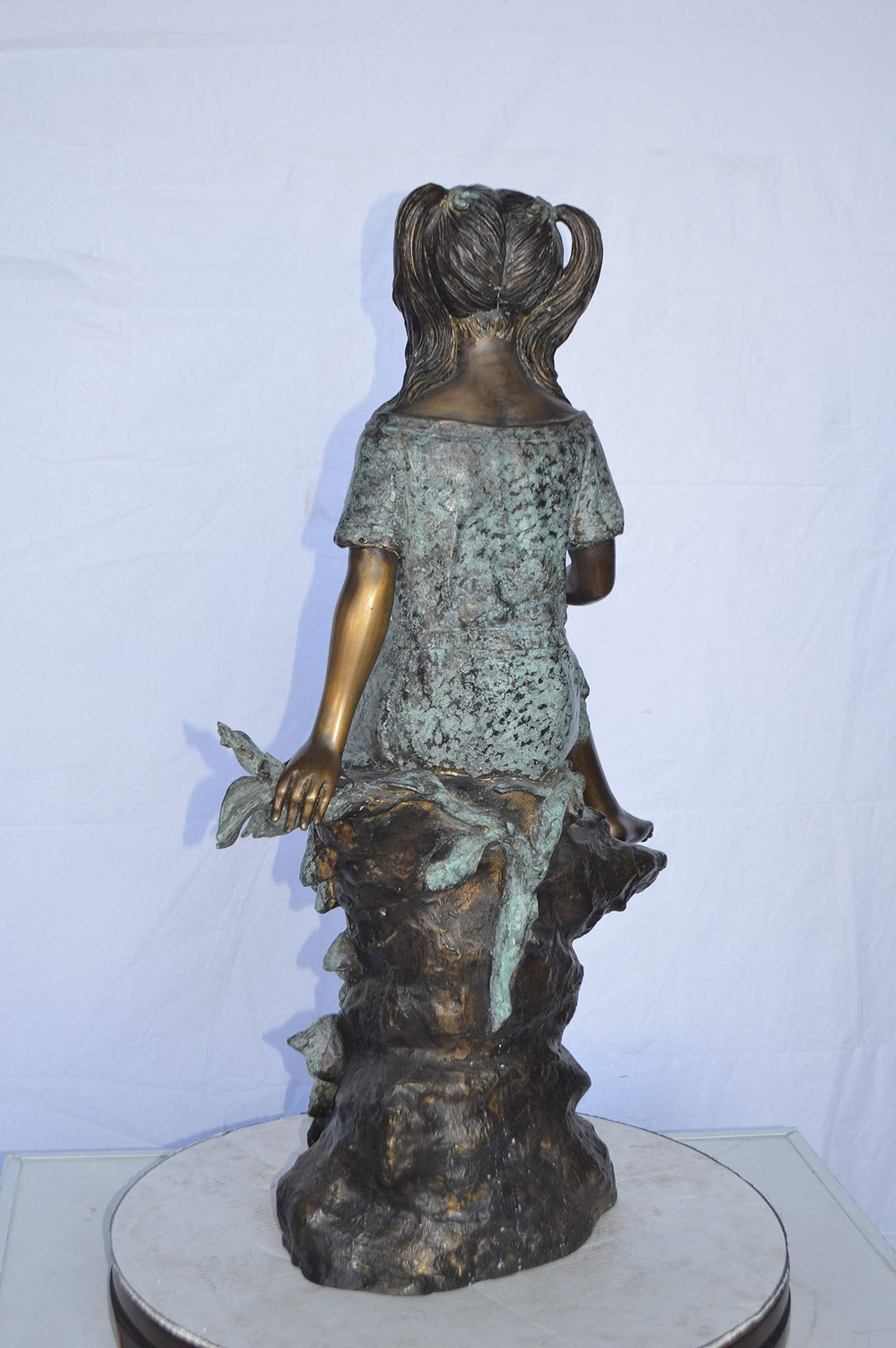 Girl on Tree Trunk Holding Flowers Bronze Statue - Size: 26"L x 11"W x 36"H. - 8