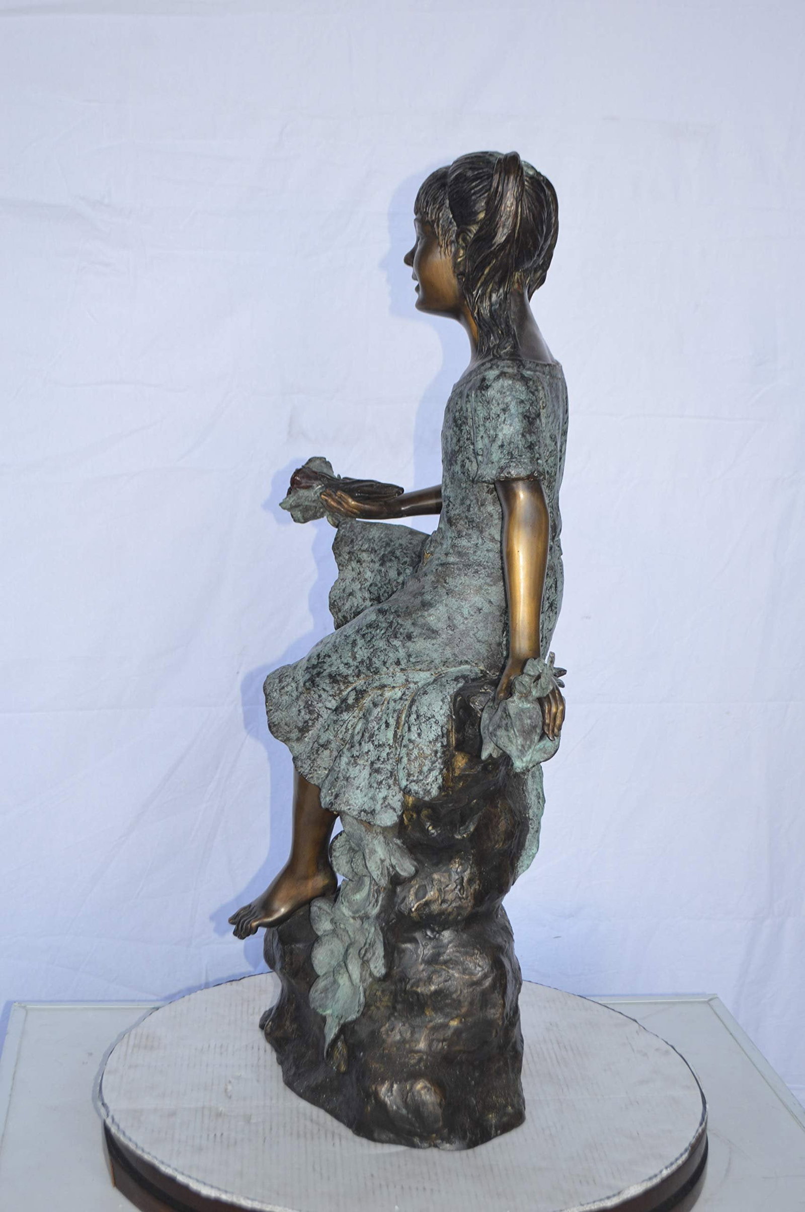 Girl on Tree Trunk Holding Flowers Bronze Statue - Size: 26"L x 11"W x 36"H. - 9