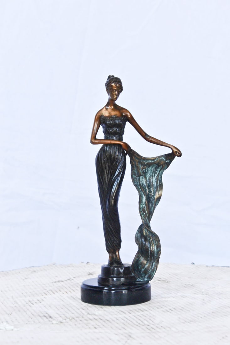 Young girl holding a sheer sheet in the wind - Size: 6"L x 4"W x 13"H. - 2