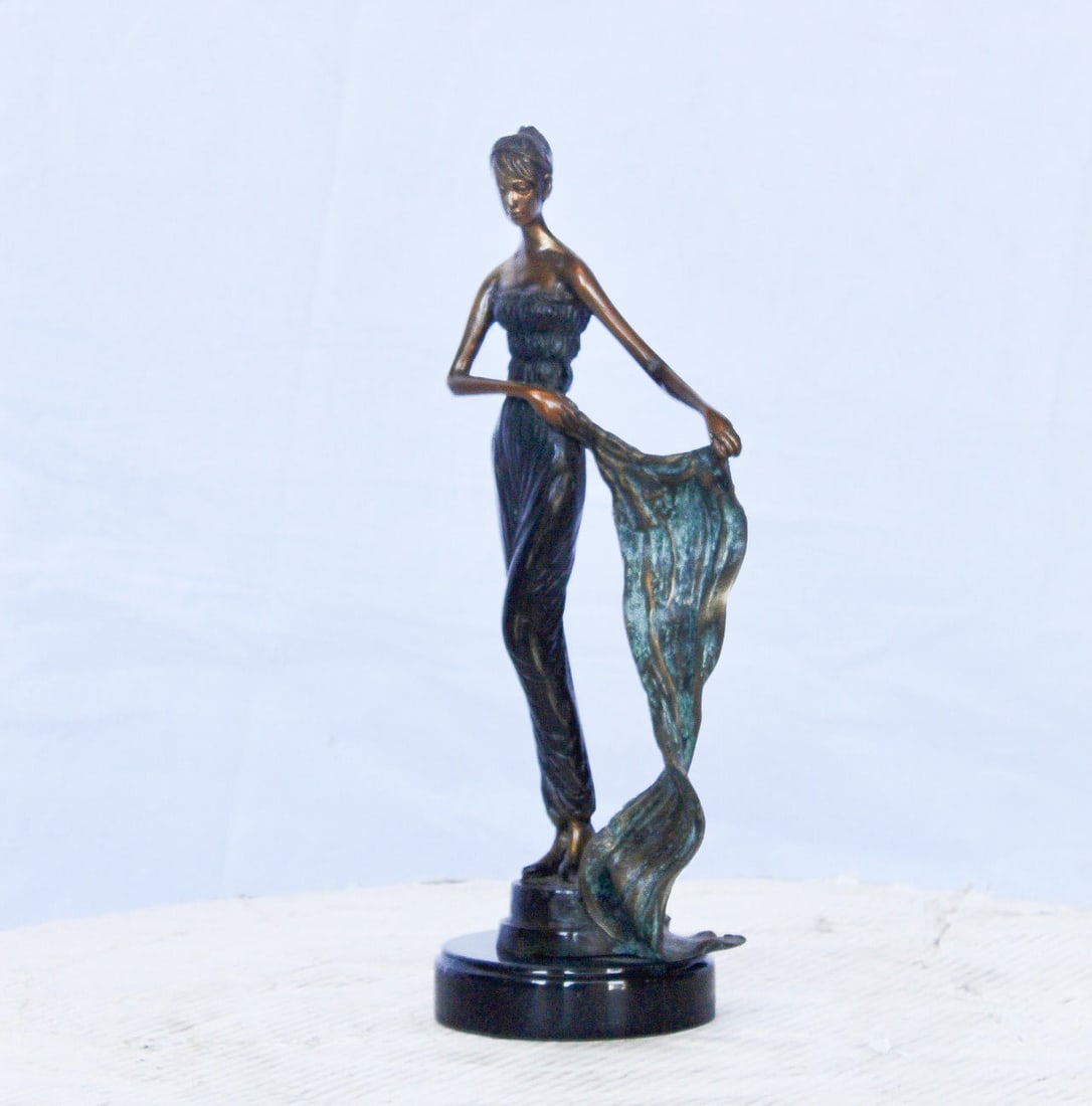 Young girl holding a sheer sheet in the wind - Size: 6"L x 4"W x 13"H. - 8