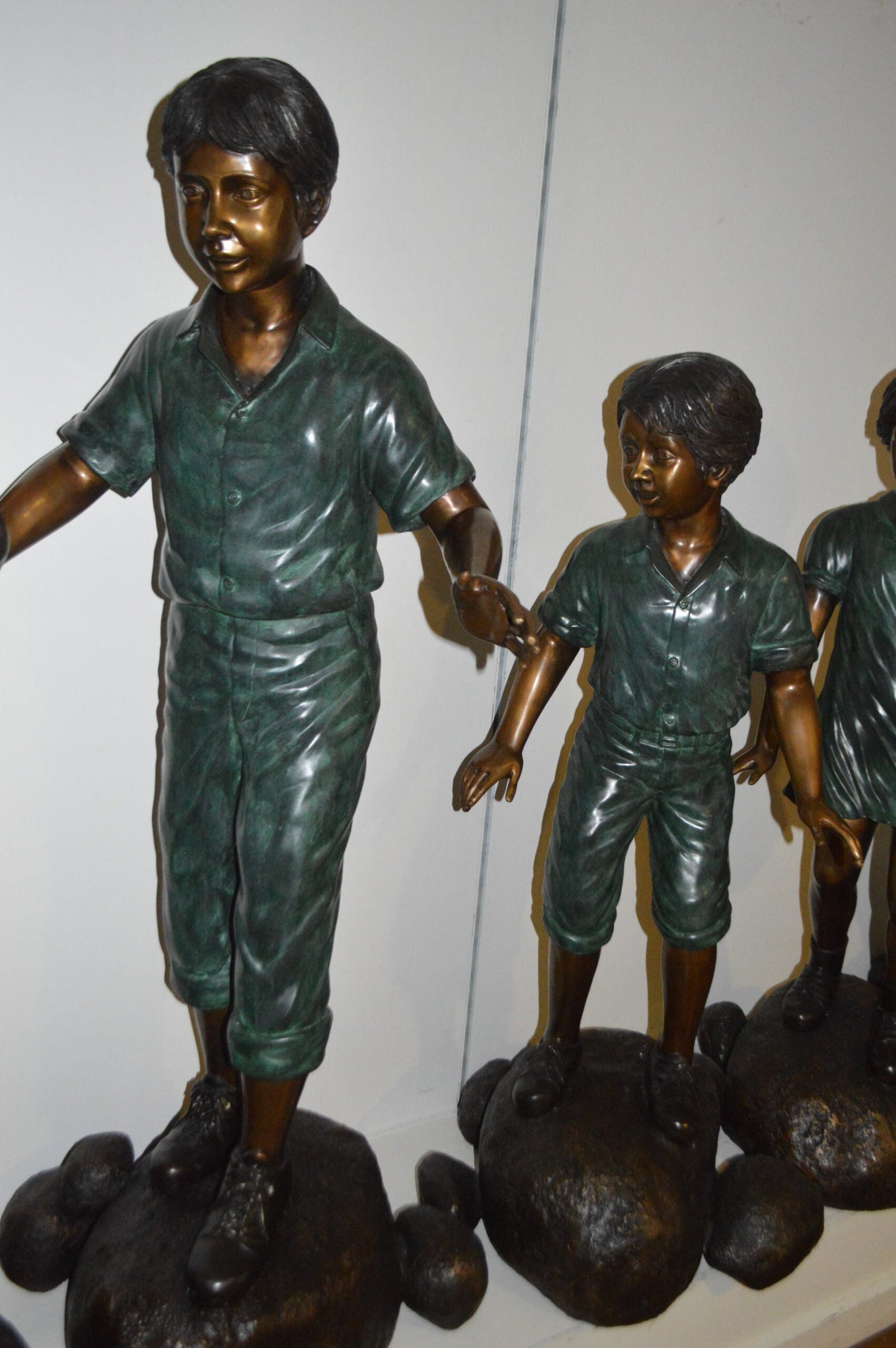 Five Kids Walking on Rocks Bronze Statues - Size: "L x "W x "H. - 5