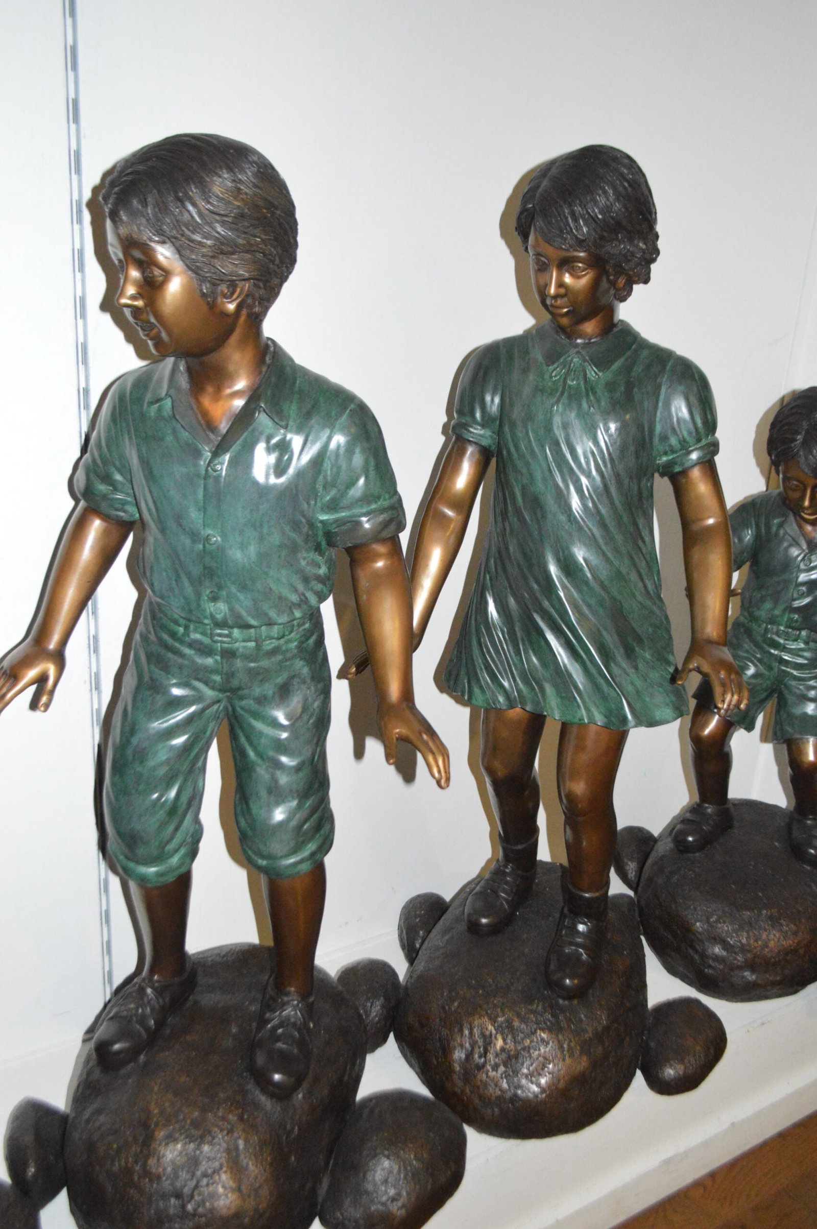 Five Kids Walking on Rocks Bronze Statues - Size: "L x "W x "H. - 6