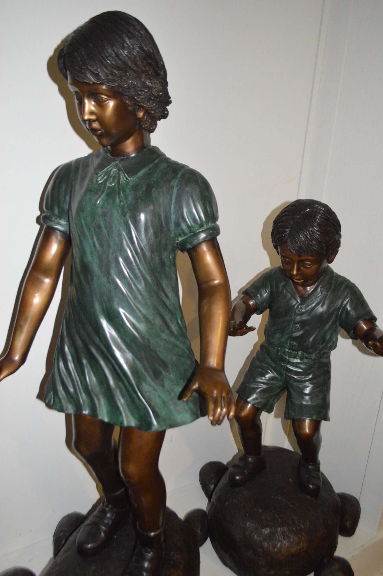 Five Kids Walking on Rocks Bronze Statues - Size: "L x "W x "H. - 7
