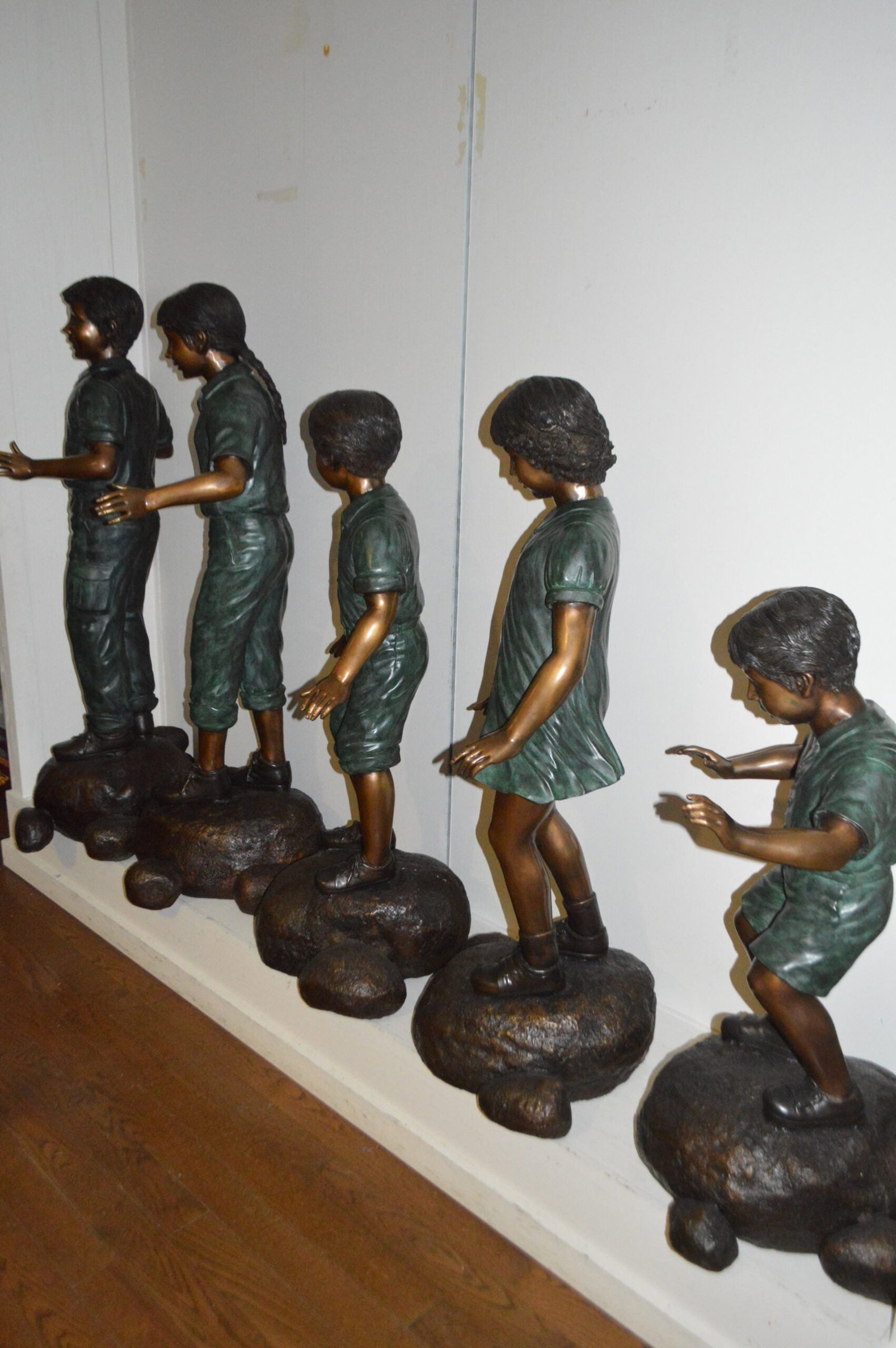 Five Kids Walking on Rocks Bronze Statues - Size: "L x "W x "H. - 8