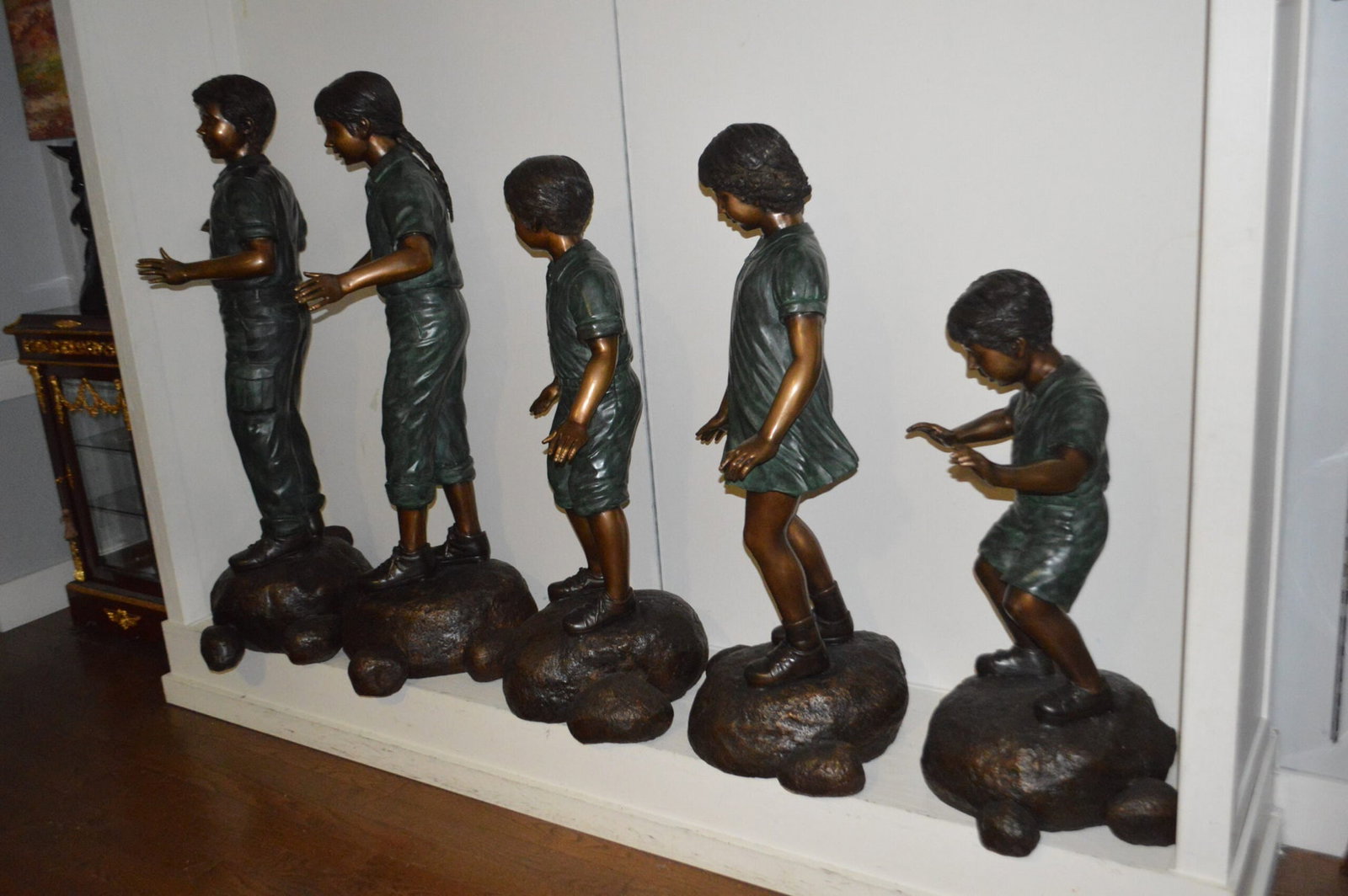 Five Kids Walking on Rocks Bronze Statues - Size: "L x "W x "H. - 9