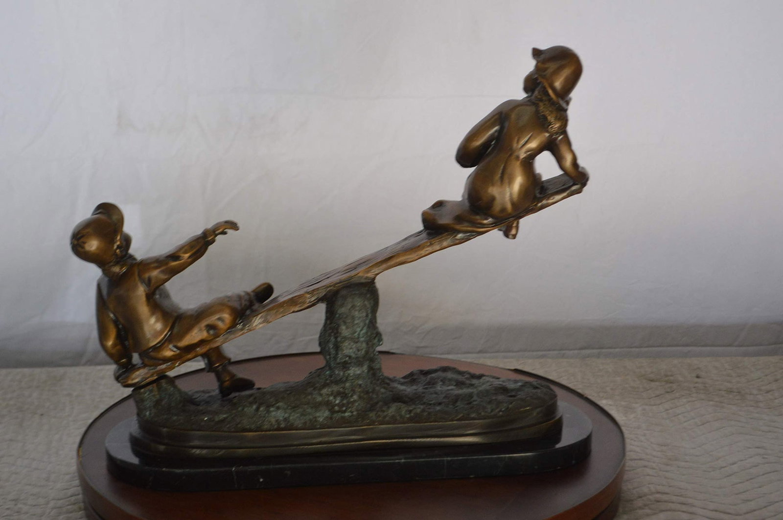 Boys Playing Seesaw on a Marble Base Bronze Statue - Size: 22"L x 8"W x 17"H. - 5
